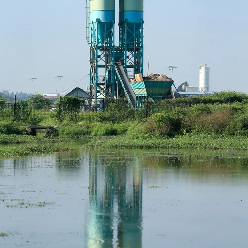 Separate industrial silos side by side — each user runs in their own isolated container